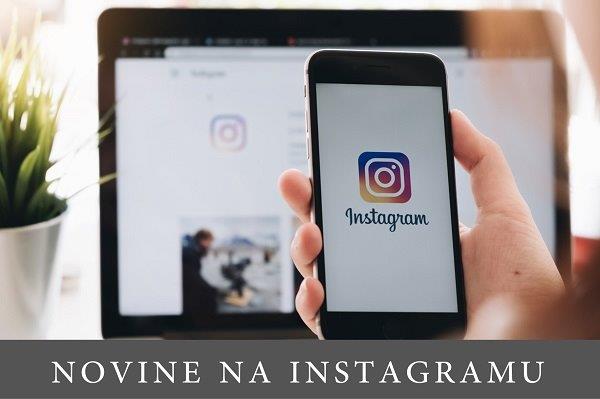 ruka koja drži pametni telsfon sa logoom Instagrama na ekranu, a u pozadini je laptop isto sa prikazom instagrama na ekranu
