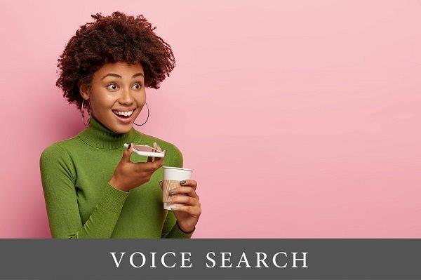 a girl talking on the phone and holding coffee in her other hand